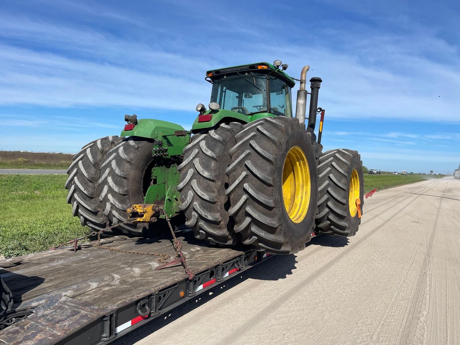 John Deere tractor on lowboy trailer