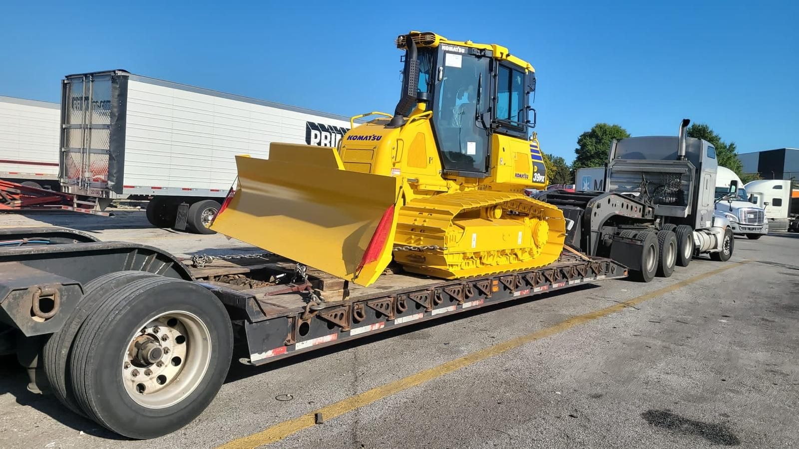 Komatsu bulldozer loaded for transport