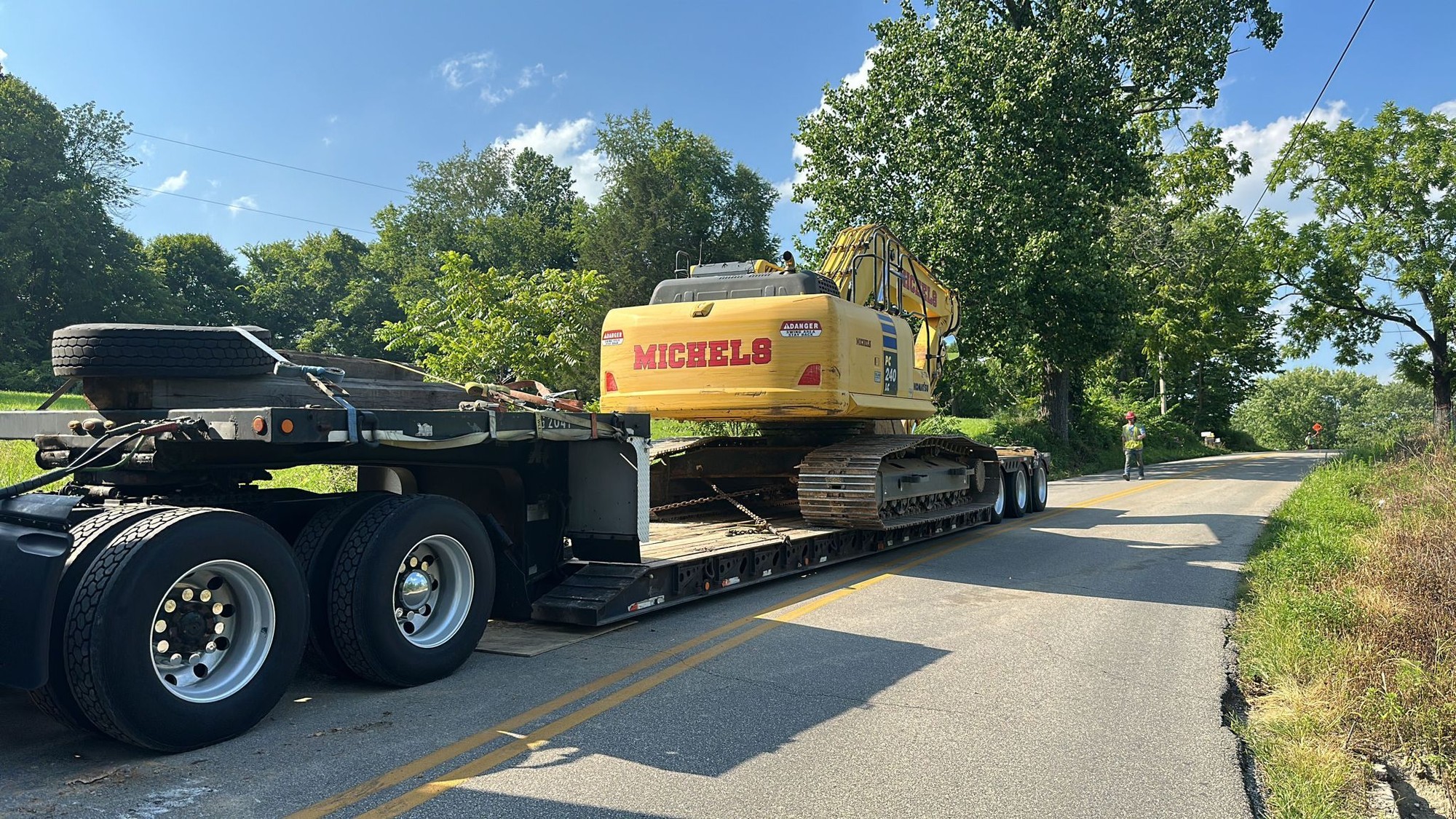 Large excavator on RGN trailer during transport